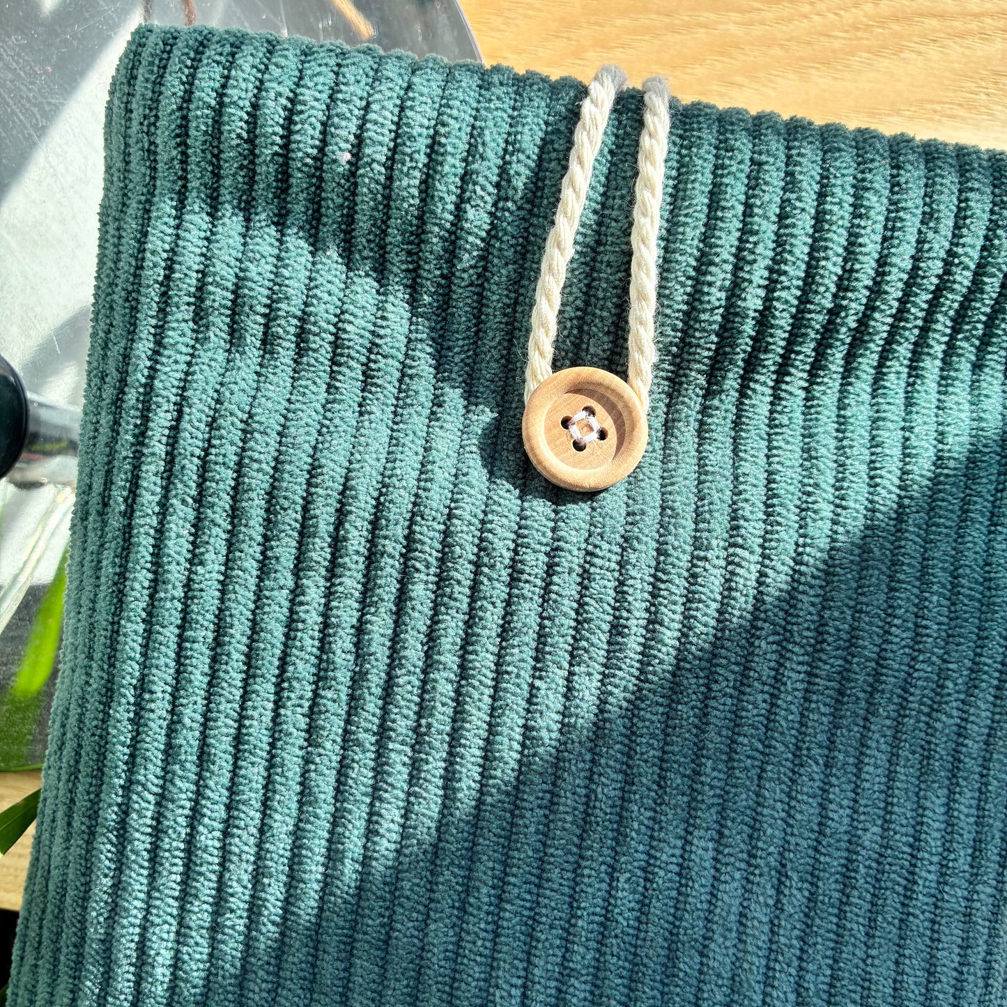 Customizable corduroy book cover in petrol blue